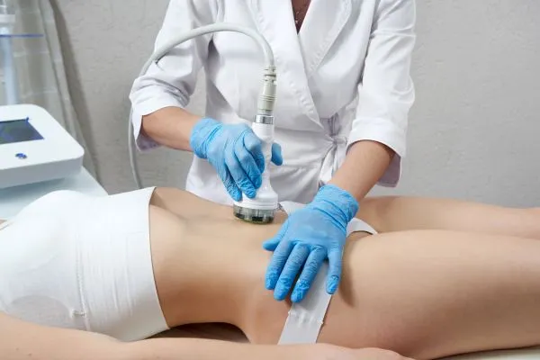 Lost the Weight but Not the Loose Skin? 2 woman having HIFU treatment on her stomach to combat loose skin Thetford following weight loss